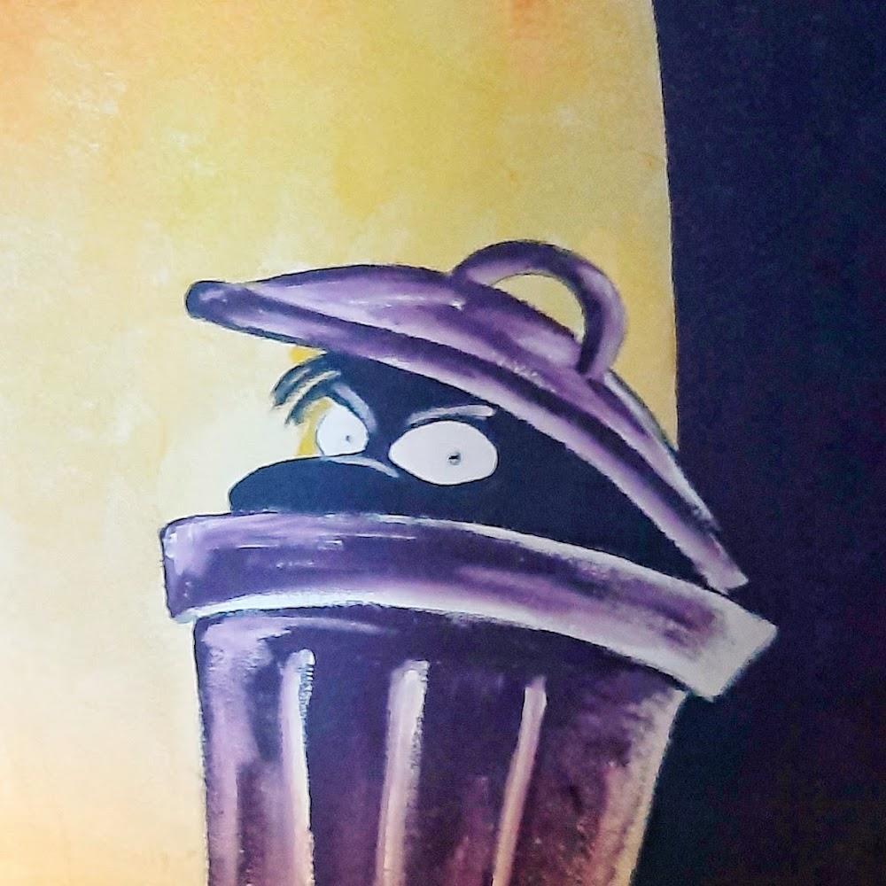 Purple trashcan with a face peeking out.